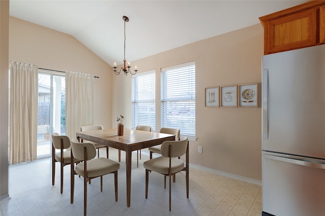 dining area featuring an inviting chandelier, lofted ceiling, and plenty of natural light