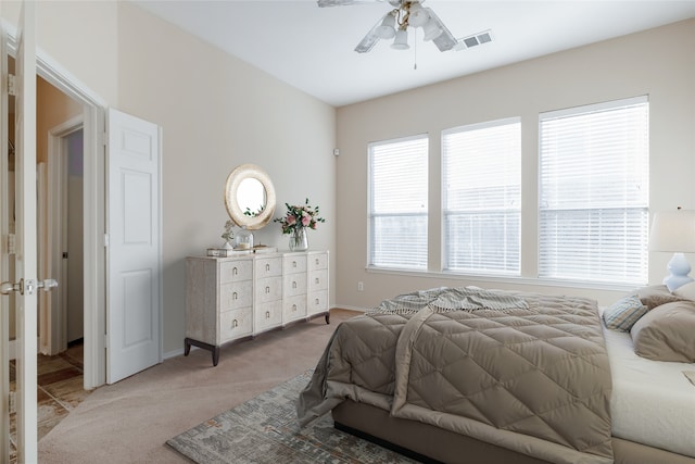 carpeted bedroom with ceiling fan