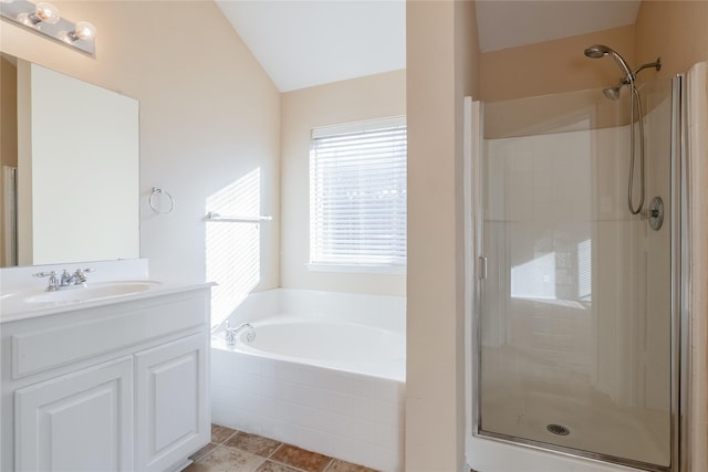 bathroom with vanity, tile patterned flooring, lofted ceiling, and shower with separate bathtub