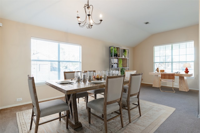 carpeted dining room with an inviting chandelier, lofted ceiling, and a wealth of natural light