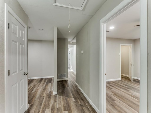 hallway featuring hardwood / wood-style flooring