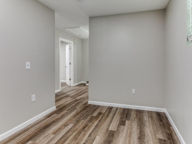 empty room with dark wood-type flooring