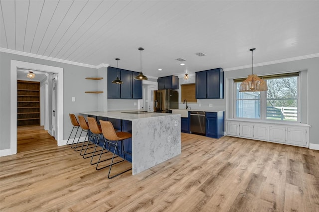 kitchen featuring a breakfast bar, light hardwood / wood-style flooring, blue cabinetry, kitchen peninsula, and stainless steel appliances