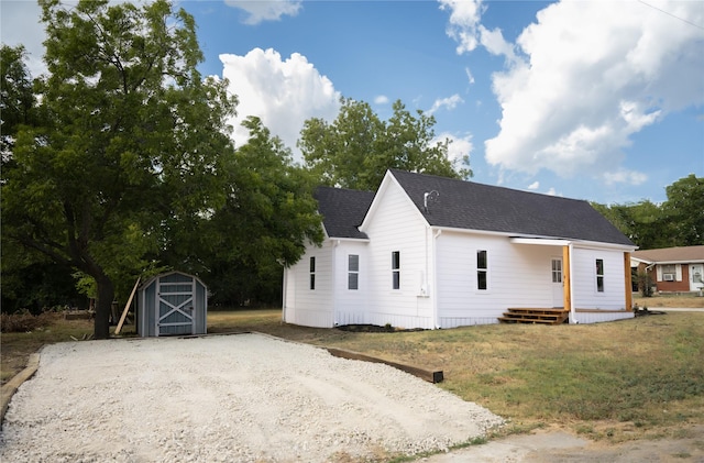 view of front facade featuring a storage shed