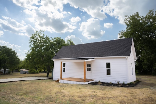 exterior space with a yard and covered porch