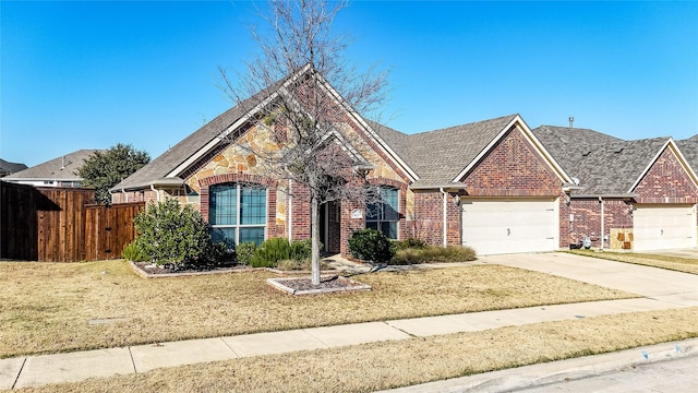 front facade featuring a garage and a front yard