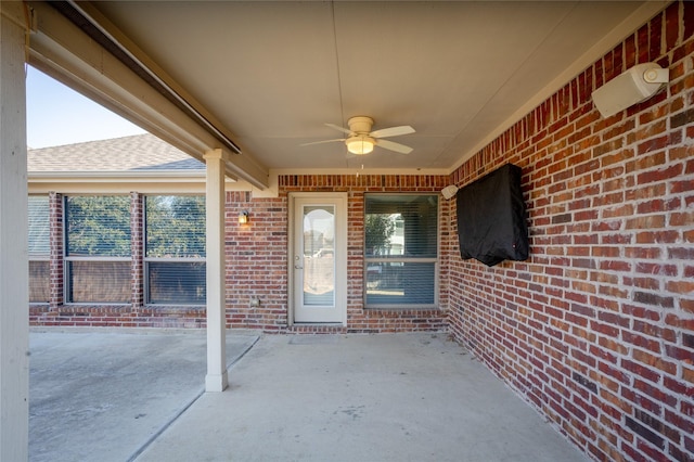 property entrance with ceiling fan and a patio