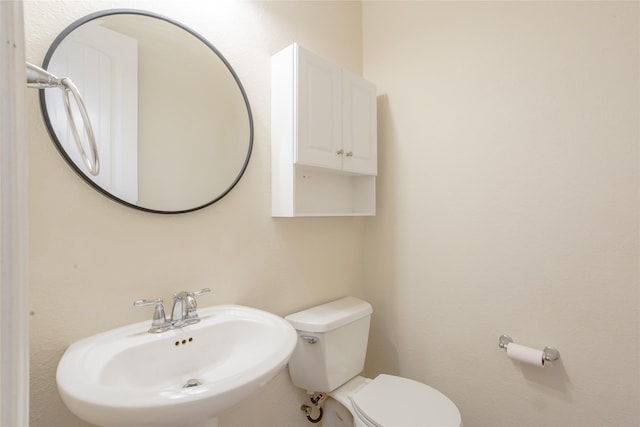 bathroom with sink and toilet