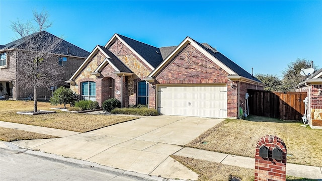 view of front of property featuring a garage and a front lawn