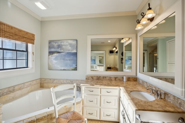 bathroom with vanity, crown molding, and tiled bath