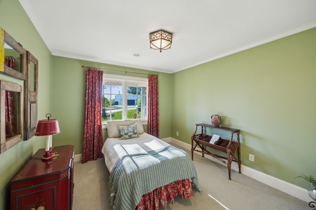 carpeted bedroom featuring crown molding