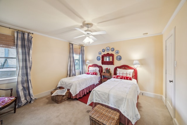 carpeted bedroom featuring ceiling fan and crown molding