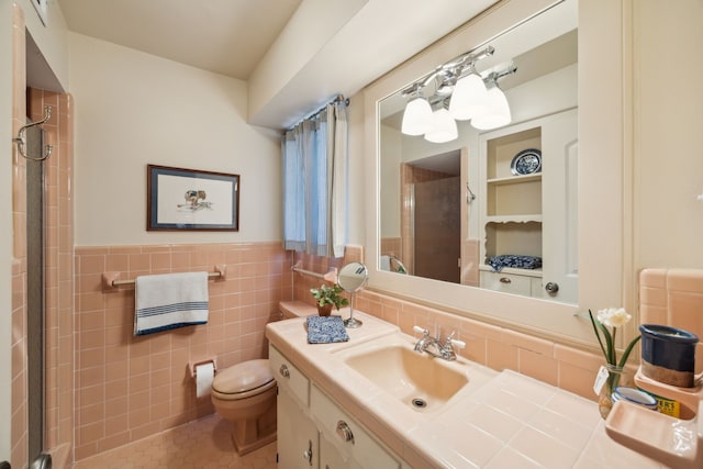 bathroom with tile patterned flooring, an enclosed shower, toilet, vanity, and tile walls