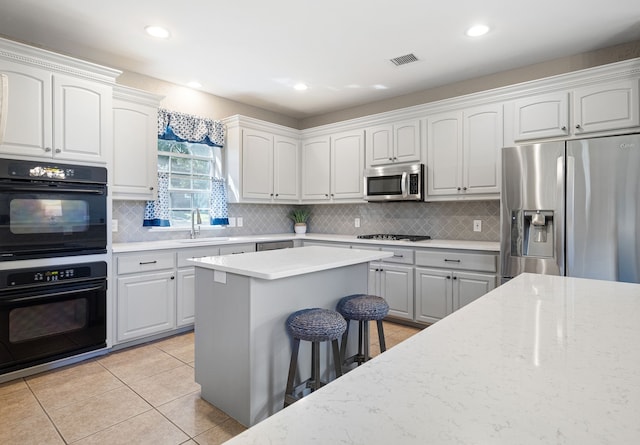 kitchen with white cabinets and stainless steel appliances