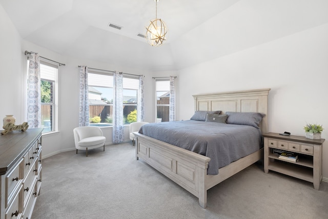 carpeted bedroom with multiple windows and lofted ceiling