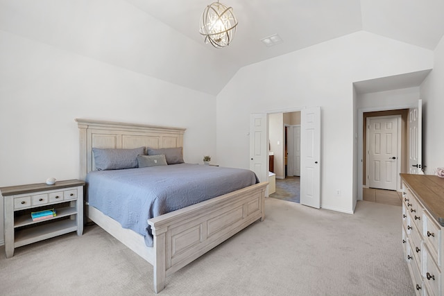 carpeted bedroom with vaulted ceiling and an inviting chandelier