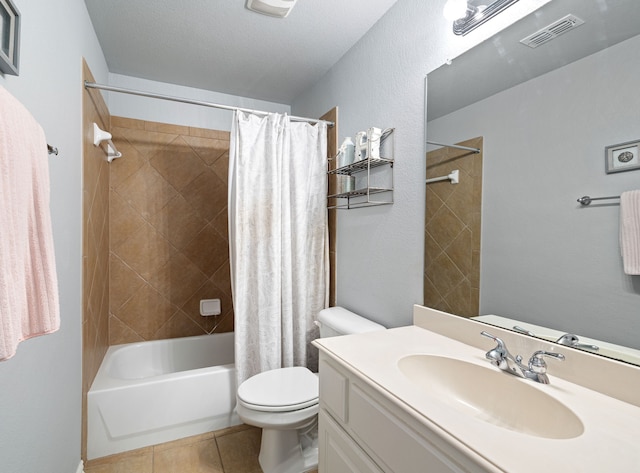 full bathroom with tile patterned flooring, shower / bath combo, vanity, and toilet