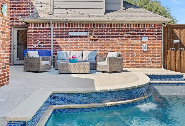 view of swimming pool featuring a patio area, pool water feature, and an outdoor living space