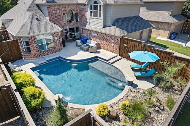 view of pool with a patio and an outdoor hangout area