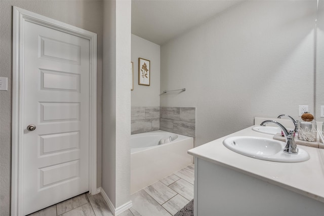 bathroom with vanity and a bathtub