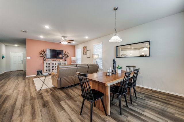 dining room featuring dark hardwood / wood-style floors and ceiling fan