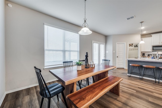 dining area featuring hardwood / wood-style floors