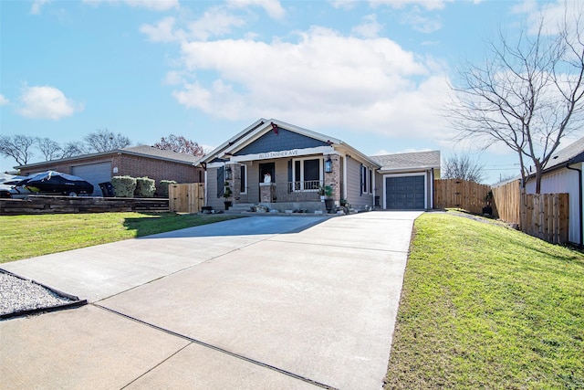 view of front of home featuring covered porch, a garage, and a front lawn