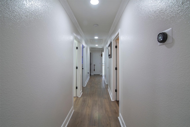 corridor with crown molding and hardwood / wood-style flooring