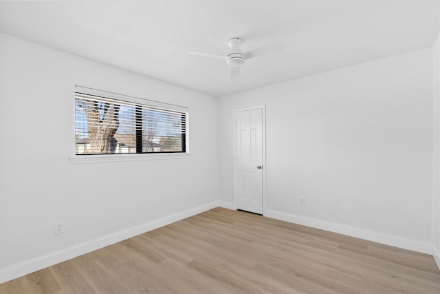 spare room with light hardwood / wood-style floors and ceiling fan