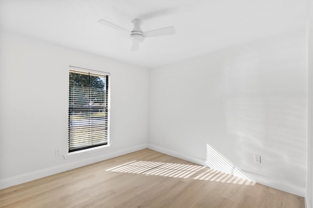 empty room featuring light wood-type flooring and ceiling fan