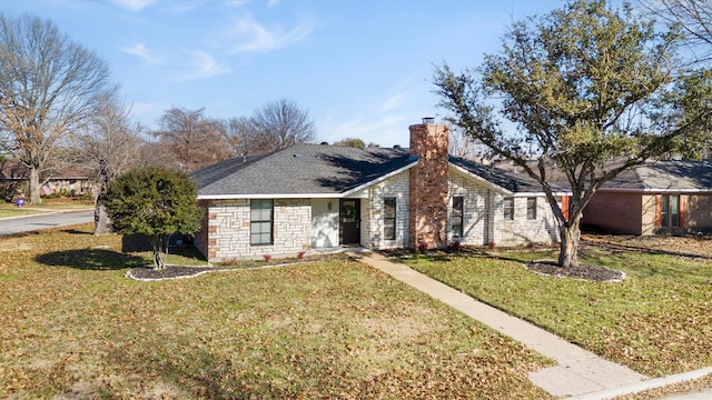 ranch-style house featuring a front lawn