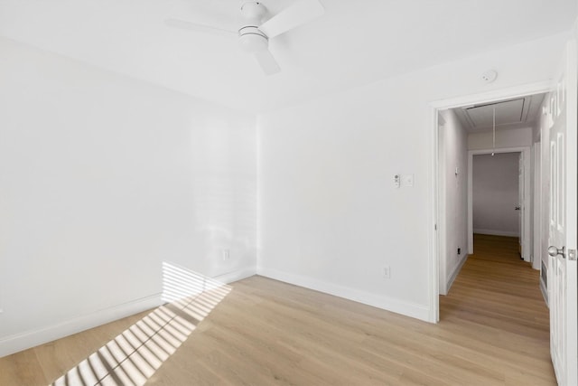 spare room featuring ceiling fan and light hardwood / wood-style floors