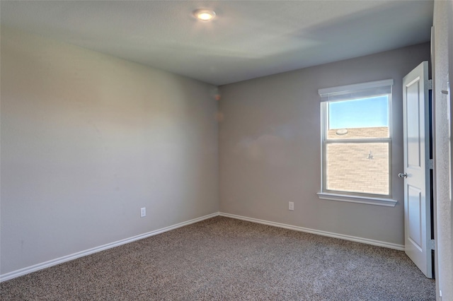 empty room with carpet flooring