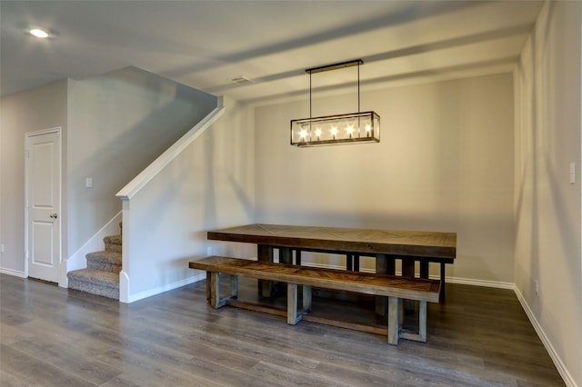 dining space with dark wood-type flooring