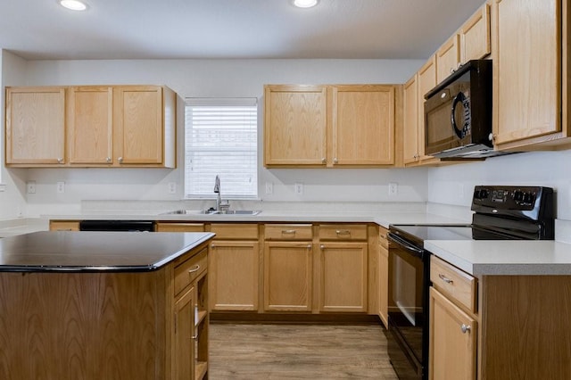 kitchen featuring black appliances, light hardwood / wood-style floors, sink, and light brown cabinetry