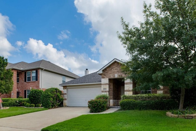 view of front of house featuring a front yard and a garage