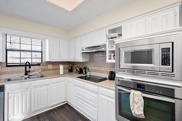 kitchen featuring white cabinetry, sink, and appliances with stainless steel finishes