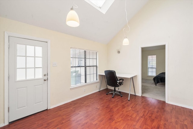 office area with a skylight, high vaulted ceiling, and wood-type flooring