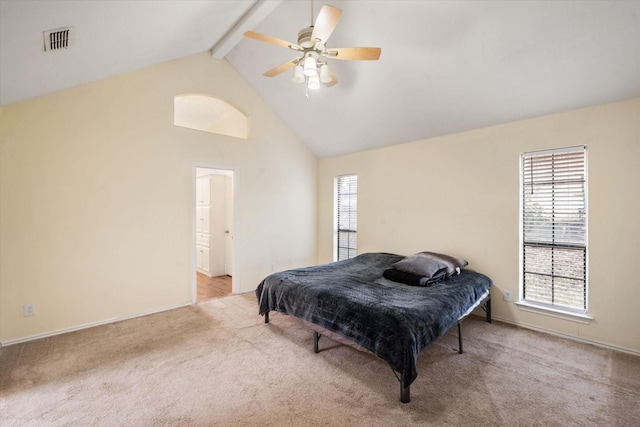 bedroom featuring multiple windows, beam ceiling, high vaulted ceiling, and light carpet