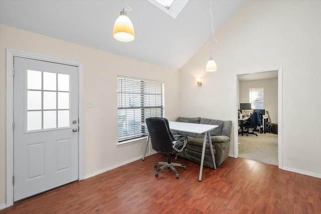 office space featuring hardwood / wood-style floors and vaulted ceiling