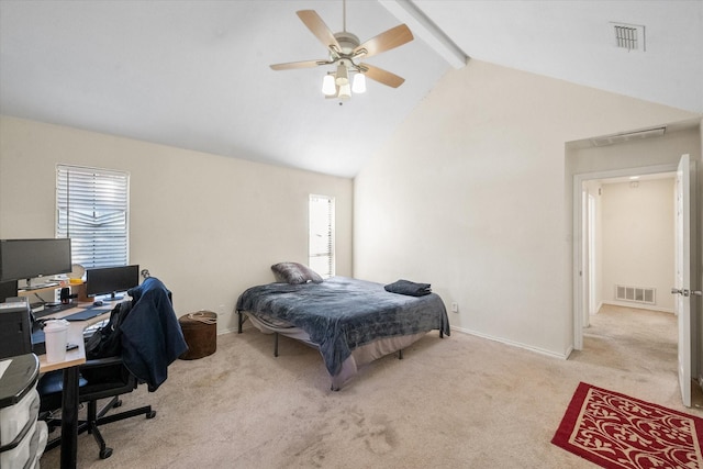 bedroom with multiple windows, ceiling fan, beamed ceiling, and light colored carpet