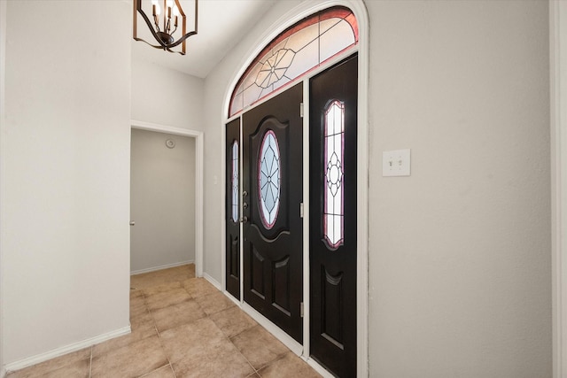 foyer featuring plenty of natural light and a notable chandelier