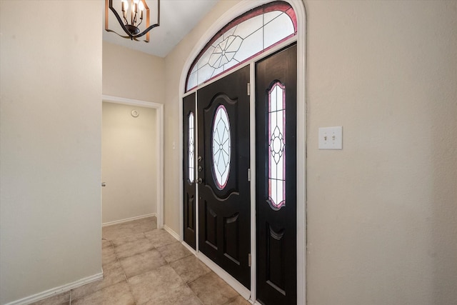 foyer with a notable chandelier