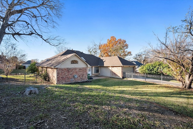 exterior space with a garage and a yard