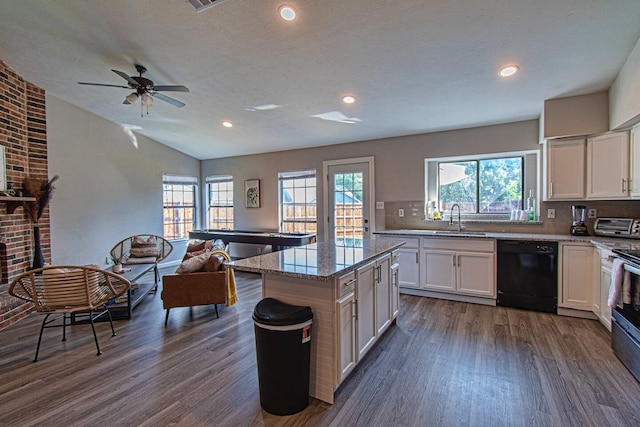 kitchen with white cabinetry, dishwasher, sink, decorative backsplash, and a kitchen island