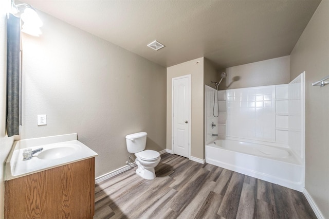 full bathroom featuring shower / bathing tub combination, vanity, toilet, and hardwood / wood-style floors