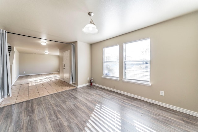 empty room with light hardwood / wood-style floors