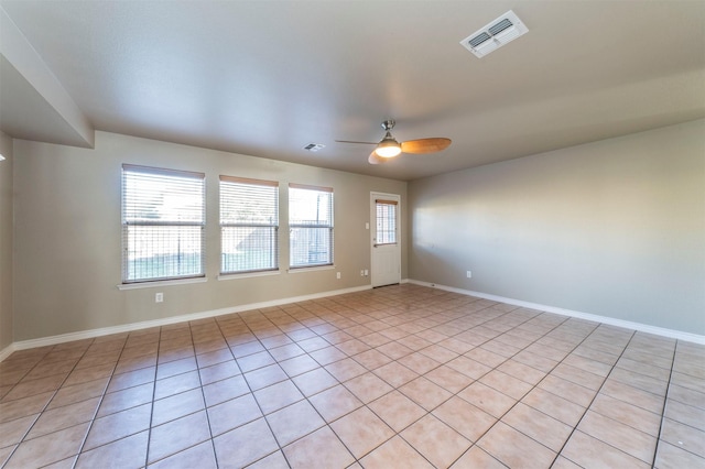 unfurnished room featuring ceiling fan and light tile patterned flooring