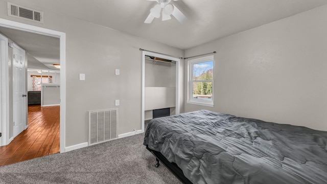 bedroom featuring ceiling fan, a closet, and carpet