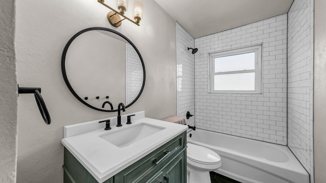 full bathroom with vanity, toilet, and tiled shower / bath combo